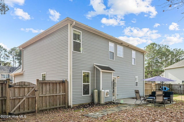 rear view of house featuring a patio area