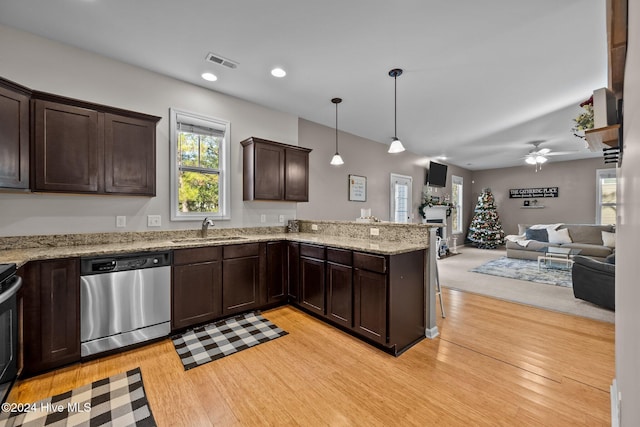 kitchen featuring sink, light hardwood / wood-style flooring, stainless steel dishwasher, ceiling fan, and decorative light fixtures