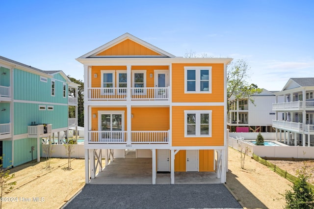 view of front of house featuring a balcony