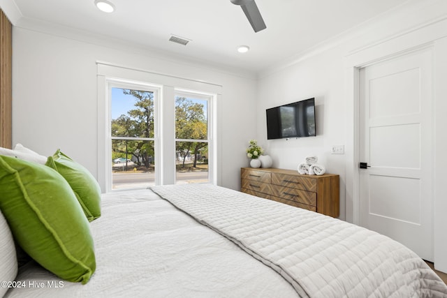 bedroom featuring access to exterior, ceiling fan, and ornamental molding