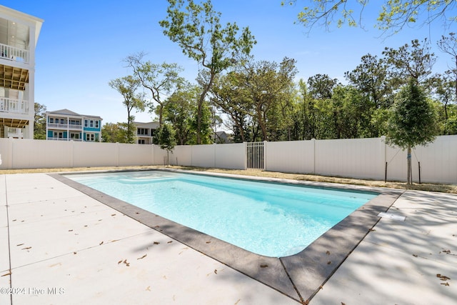 view of swimming pool featuring a patio