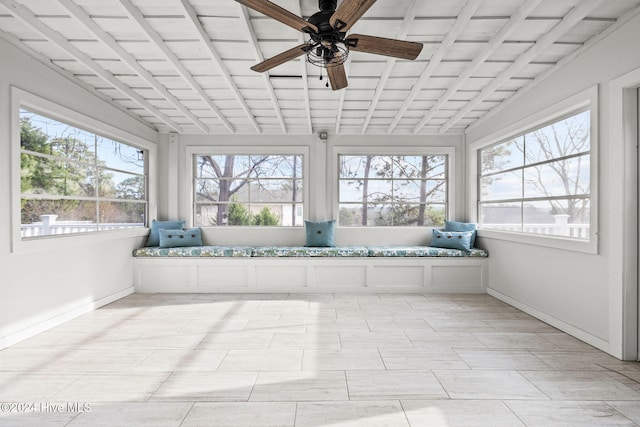 unfurnished sunroom featuring ceiling fan and lofted ceiling