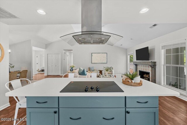 4 Emerald Ln, Pinehurst, NC 28374 - kitchen with open floor plan, black electric cooktop, island range hood, lofted ceiling, and dark wood finished floors