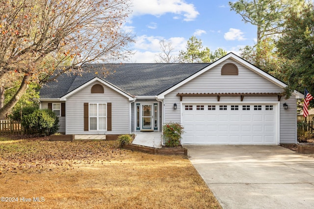 ranch-style house featuring a garage