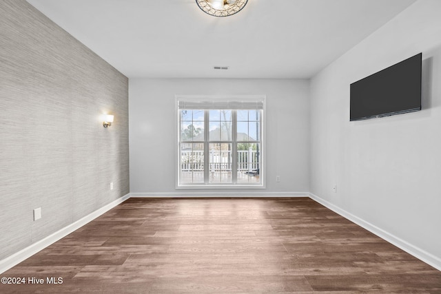 empty room featuring dark hardwood / wood-style floors