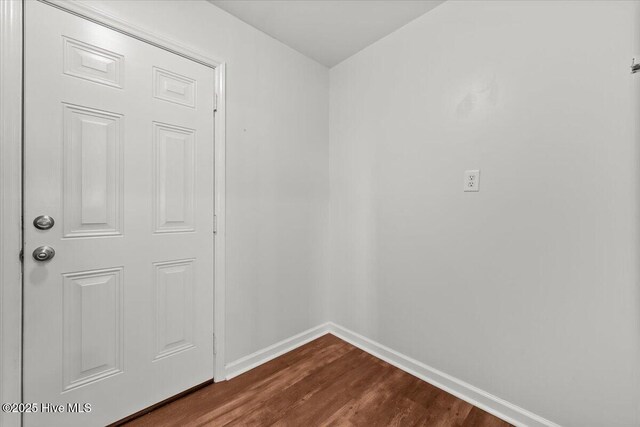 4 Emerald Ln, Pinehurst, NC 28374 - spare room featuring baseboards and dark wood-type flooring
