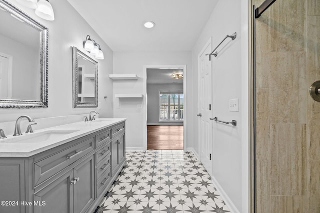 bathroom featuring vanity and an enclosed shower