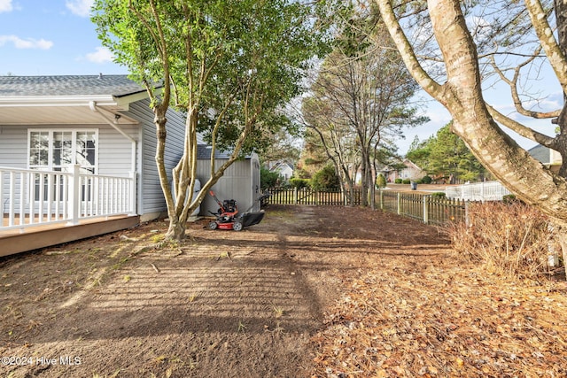 view of yard with a wooden deck