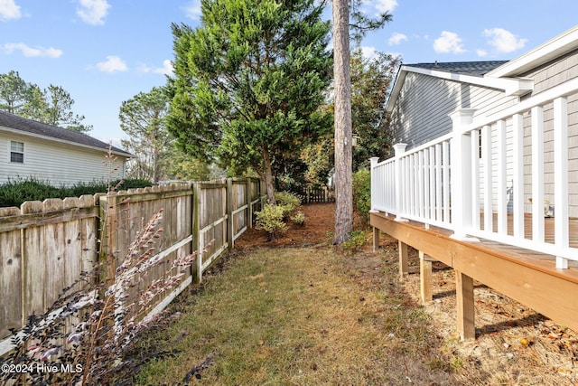 view of yard featuring a wooden deck