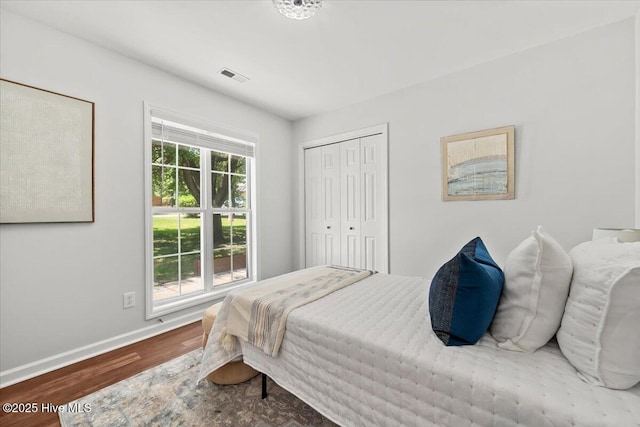 4 Emerald Ln, Pinehurst, NC 28374 - bedroom with wood finished floors, baseboards, and a closet