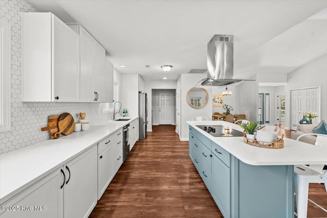 4 Emerald Ln, Pinehurst, NC 28374 - kitchen featuring stainless steel appliances, island range hood, a kitchen breakfast bar, tasteful backsplash, and recessed lighting