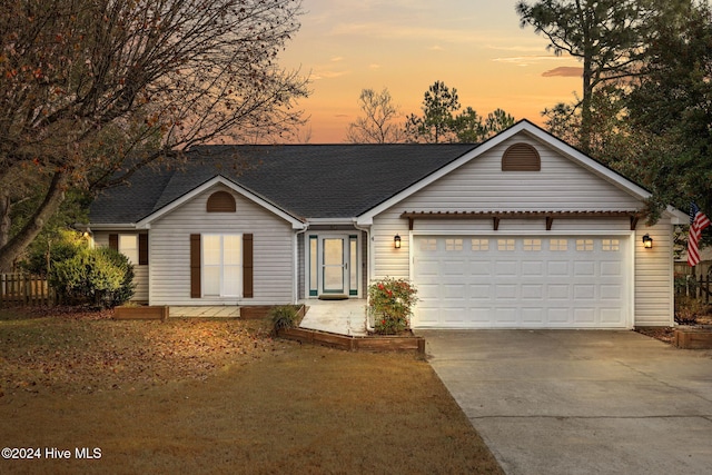 single story home featuring a garage