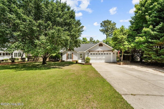 4 Emerald Ln, Pinehurst, NC 28374 - view of front facade featuring a garage, driveway, and a front lawn