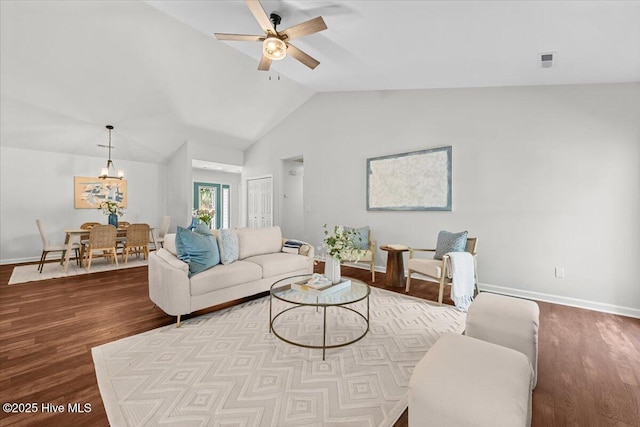 4 Emerald Ln, Pinehurst, NC 28374 - living room with wood finished floors, ceiling fan, vaulted ceiling, a chandelier, and baseboards