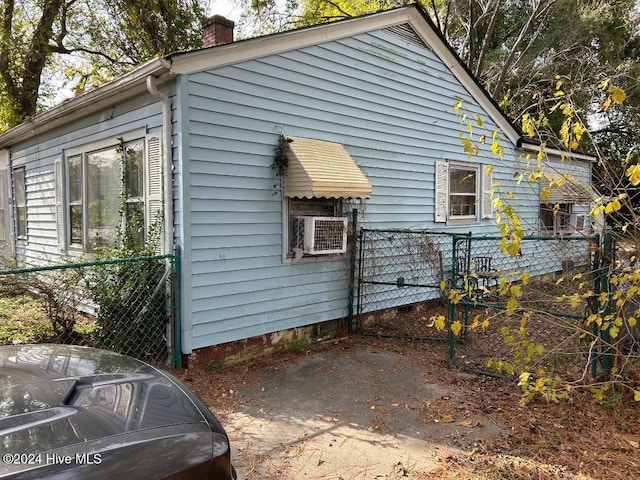 view of side of property featuring cooling unit