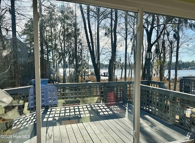 wooden deck featuring a water view