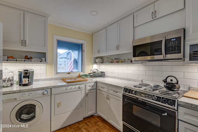 kitchen featuring stainless steel microwave, black range with electric cooktop, decorative backsplash, crown molding, and open shelves