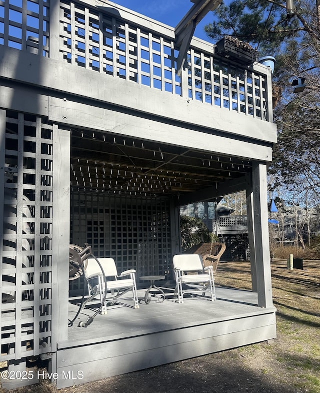 view of patio with a balcony and a deck