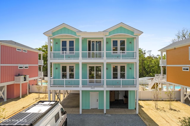 exterior space featuring a balcony and a carport