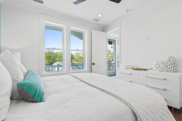 bedroom with ceiling fan, dark hardwood / wood-style floors, ornamental molding, and access to outside