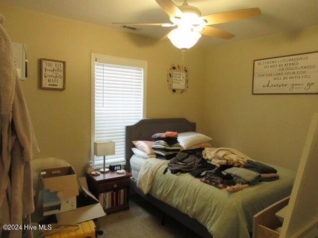 carpeted bedroom featuring ceiling fan