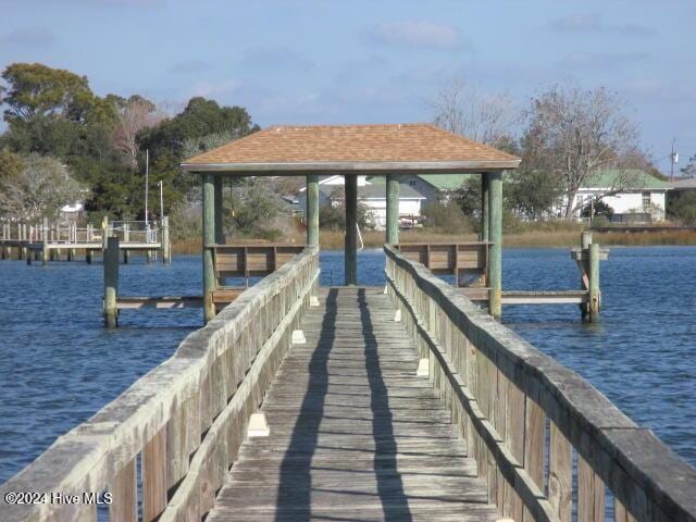 dock area featuring a gazebo and a water view