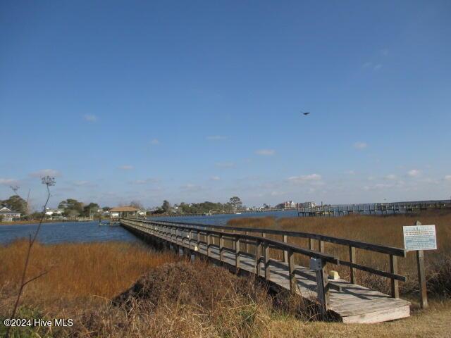 exterior space with a pier and a water view