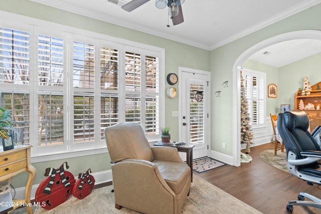 office featuring hardwood / wood-style flooring, ornamental molding, and ceiling fan