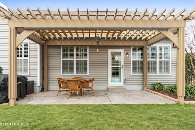 view of patio featuring area for grilling and a pergola