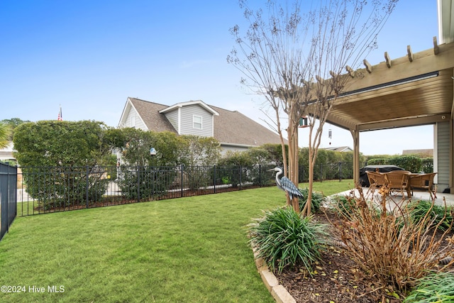 view of yard with a fenced backyard and a patio area
