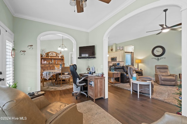 office space featuring crown molding, lofted ceiling, dark hardwood / wood-style flooring, and ceiling fan with notable chandelier