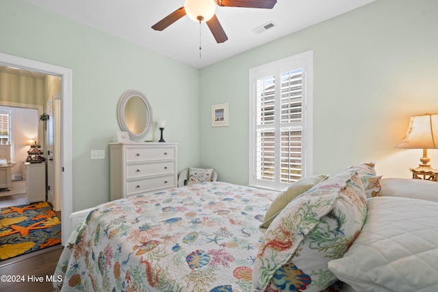 bedroom with wood-type flooring and ceiling fan