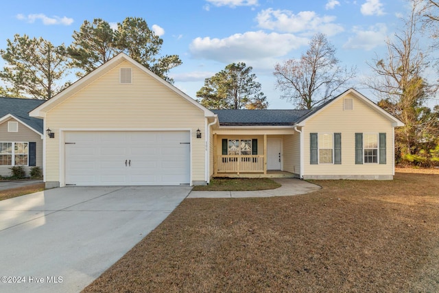 ranch-style home with covered porch and a garage