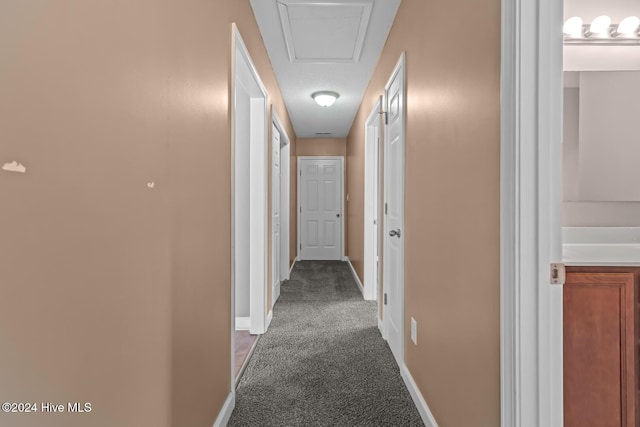 corridor with dark carpet