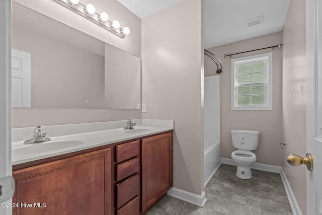 full bathroom featuring shower / tub combination, vanity, and toilet