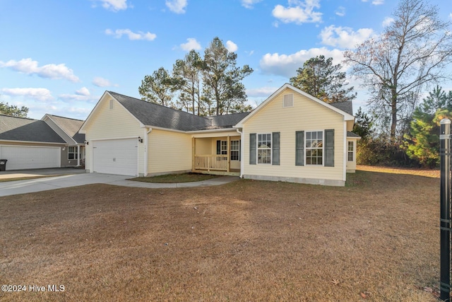 ranch-style home with a porch and a garage