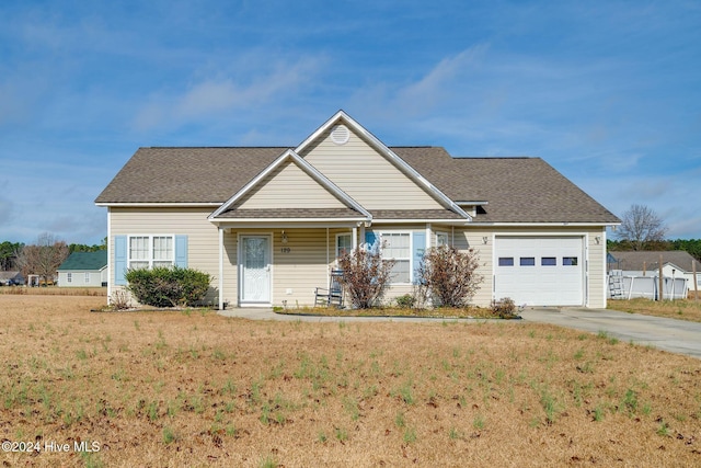 view of front of home with a garage and a front yard