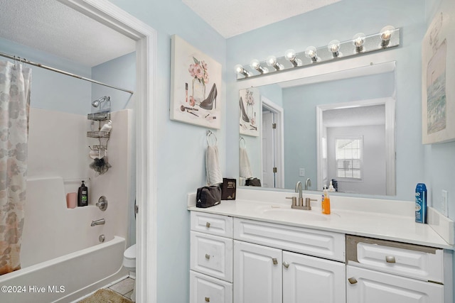 full bathroom with vanity, toilet, shower / bathtub combination with curtain, and a textured ceiling