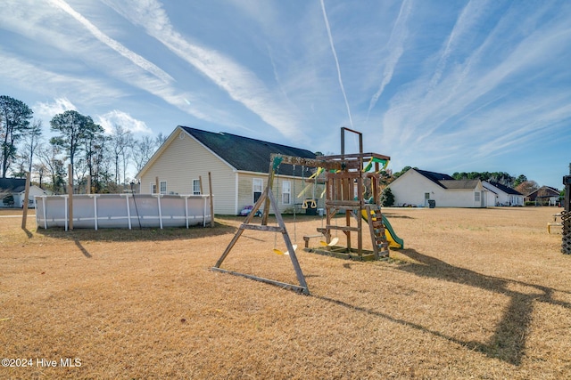 view of jungle gym with a yard