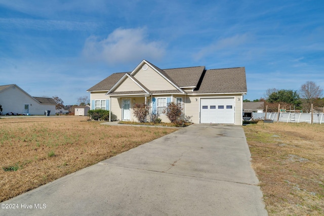 view of front facade with a garage and a front yard