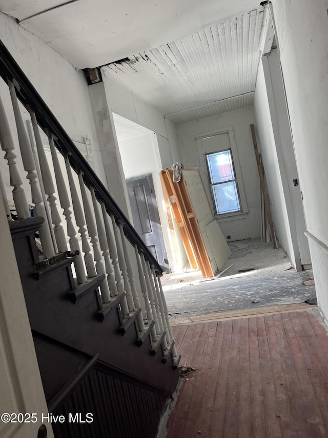 stairway featuring hardwood / wood-style flooring