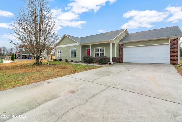 ranch-style house with a front yard and a garage