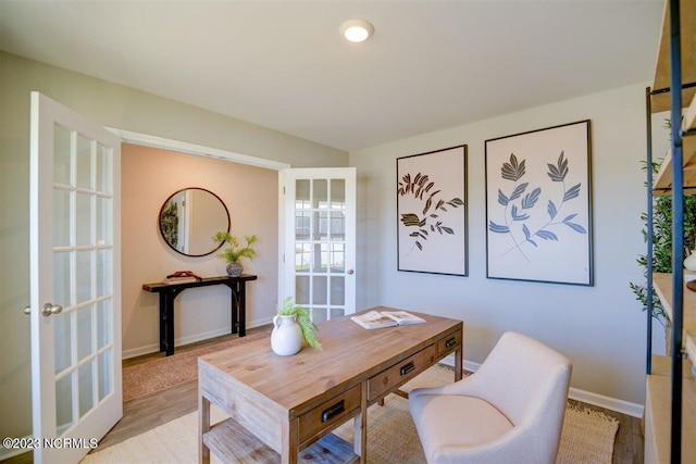 office space with french doors and light wood-type flooring