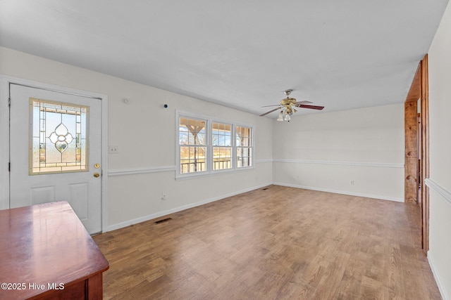 entryway with ceiling fan, plenty of natural light, and light wood-type flooring