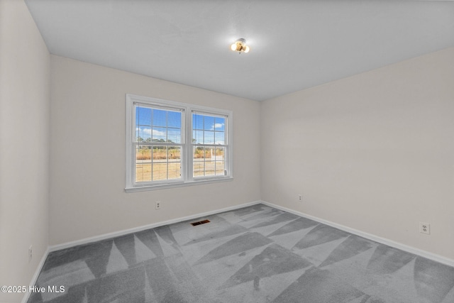 empty room featuring carpet flooring