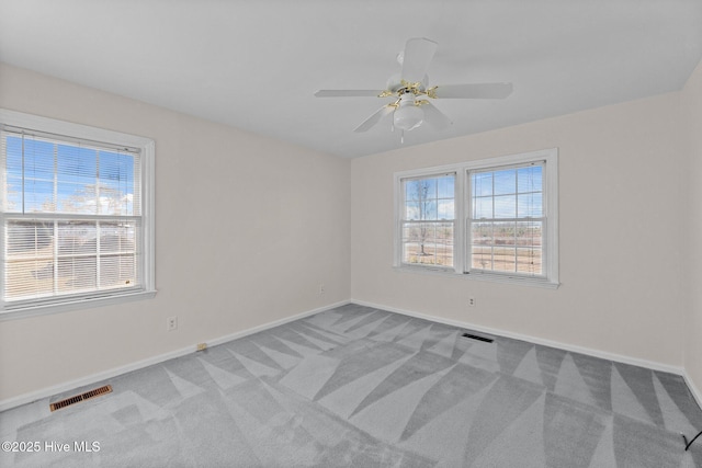 empty room with light carpet and ceiling fan