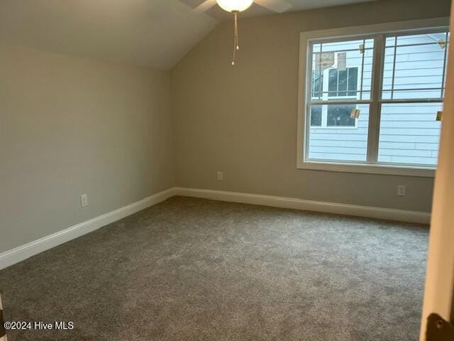 additional living space with ceiling fan, carpet floors, and vaulted ceiling