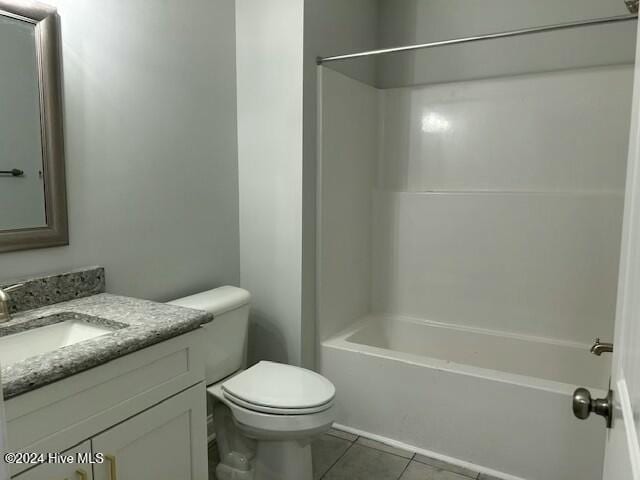 full bathroom featuring tile patterned floors, vanity, shower / bathtub combination, and toilet