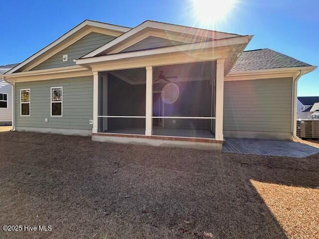 back of house featuring a patio area and a sunroom