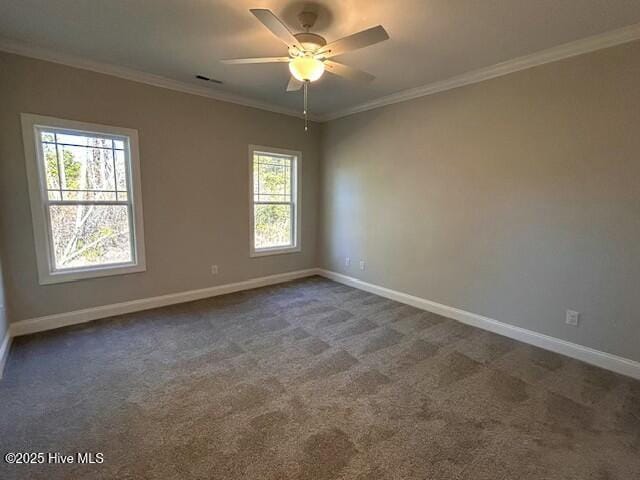 carpeted spare room with crown molding and ceiling fan